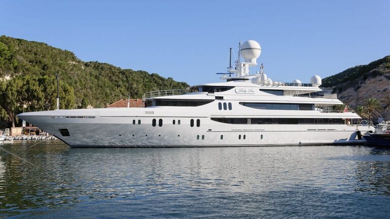 Luxury superyacht anchored near Bonifacio, Corsica — the ultimate symbol of ultra-wealth, now purchasable or charterable with Bitcoin and cryptocurrency