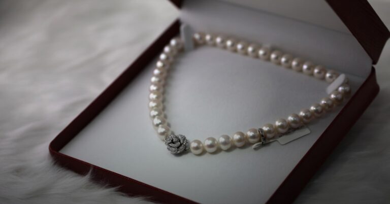Fine gold jewelry on dark surface — buy Cartier with Bitcoin