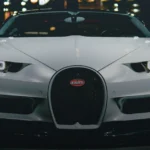 Bugatti hypercar on dark luxury background — buy with Bitcoin