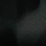 Woven carbon texture — the signature material language of Richard Mille watchmaking